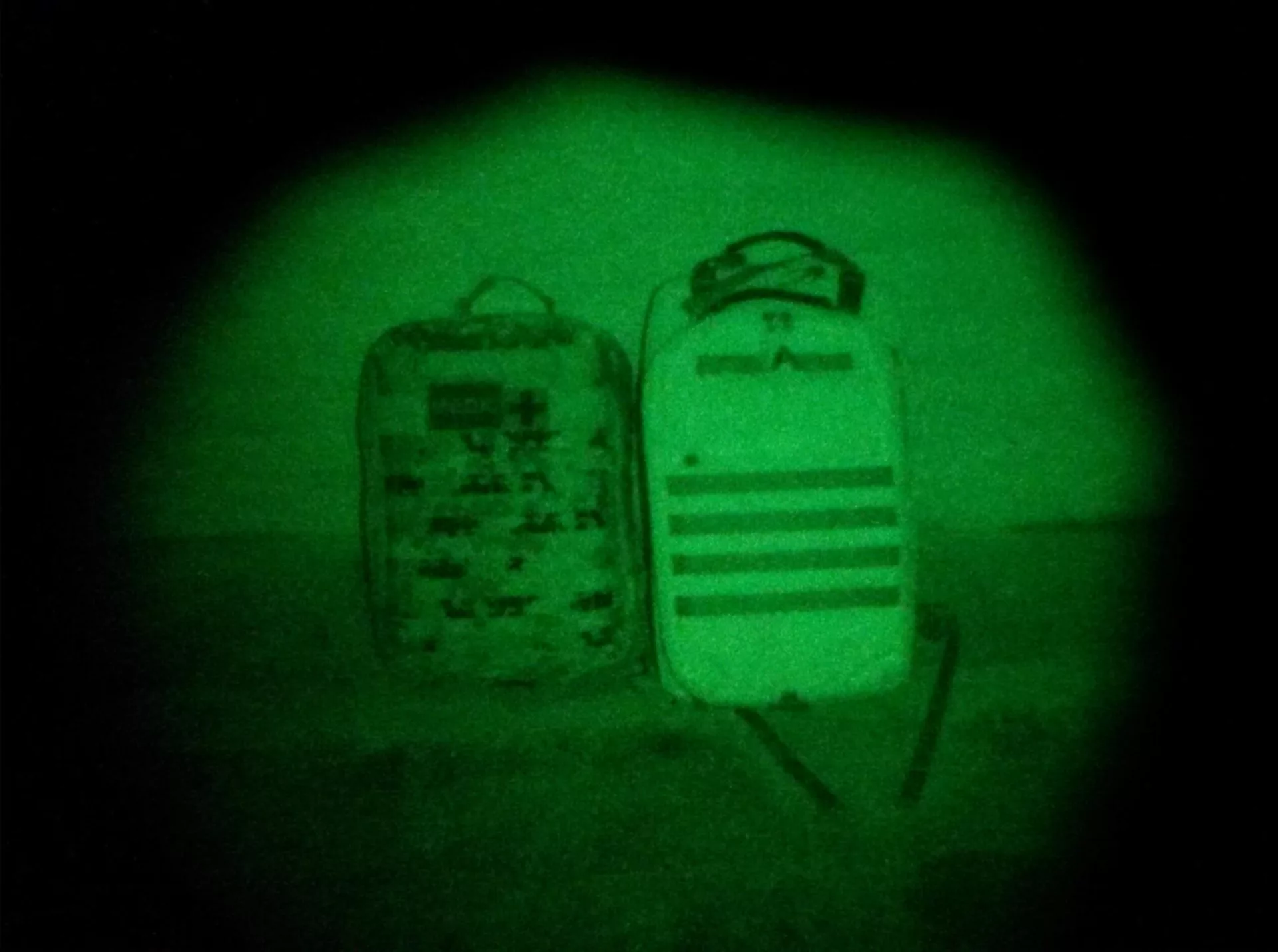 Two rucksacks with night vision equipment viewed